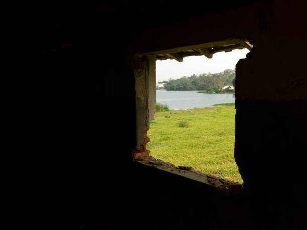 istock Window of an old abandoned house - view from inside 1276480468