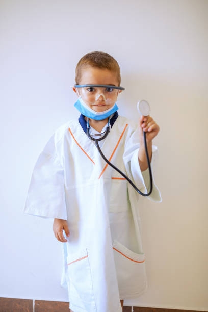istock Boy in doctor uniform 1276481525