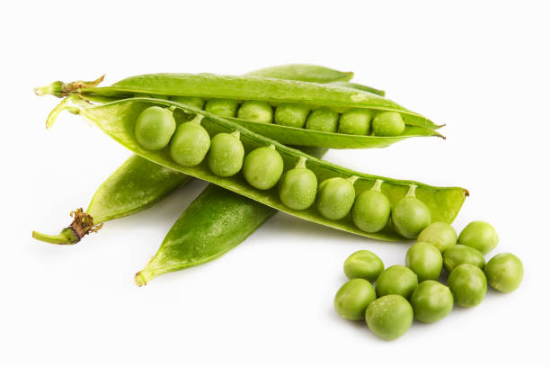 istock Fresh green pea pods and seeds on white background 1276484192