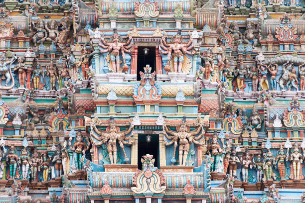 Hundreds of deity figures adorn the ancient Meenakshi temple in Madurai, Tamil Nadu, India