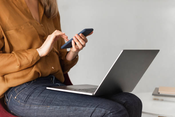 istock Unrecognizable Businesswoman Using a Smartphone at Work 1276491186
