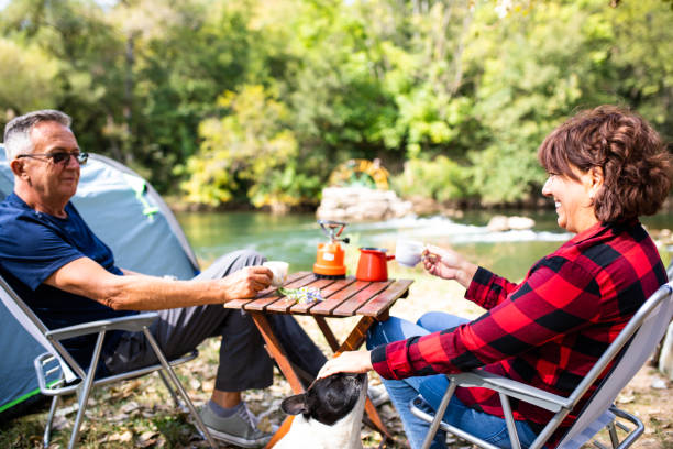 istock A happy senior couple camping with their dog 1276491399
