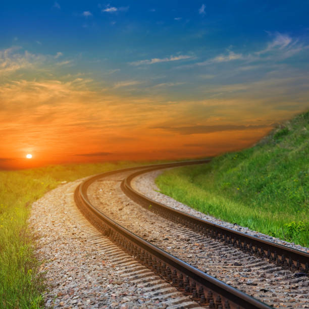 istock railway turn at the sunset, outdoor transportation scene 1276492606