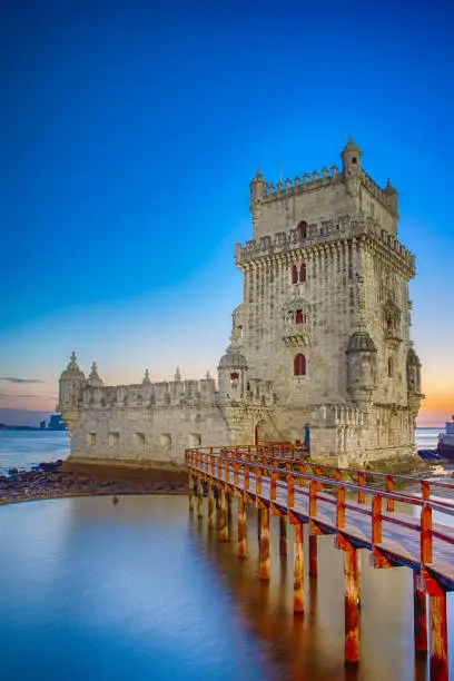 Famous Belem Tower on Tagus River in Lisbon at Blue Hour, Portugal. Vertical Image Composition