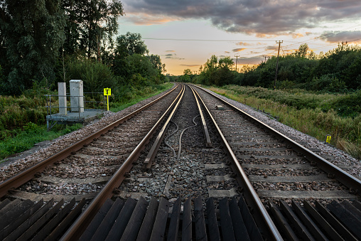 Railway tracks on the Canterbury to London route stretch out into the distance under an evening sunset sky on September 11, 2020 in Canterbury, Kent, England.