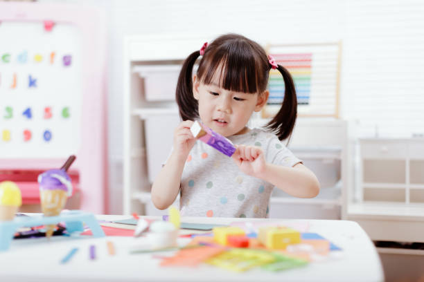 istock young girl decorating handmade craft for home schooling 1276504630
