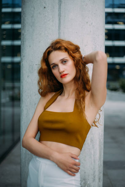 istock beautiful red haired girl looking in the camera 1276505315