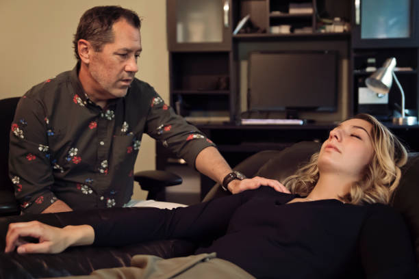istock Hypnotherapist in session with client in office. 1276508973