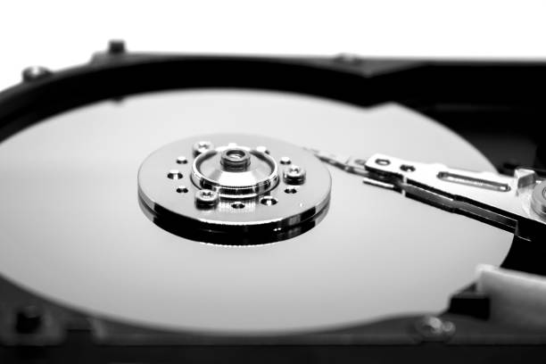 istock Hard drive from the computer hdd with mirror effect. Close-up, macro, on a white background. And repair tools. 1276509211