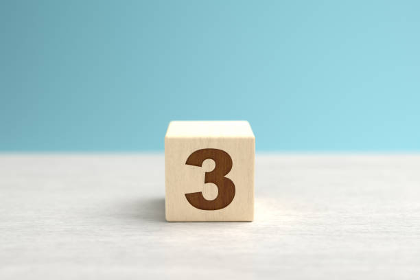 istock A wooden toy cube with the number 3. 1276510337