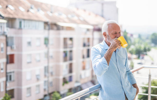 istock Mature man relaxing at home balcony. 1276511802