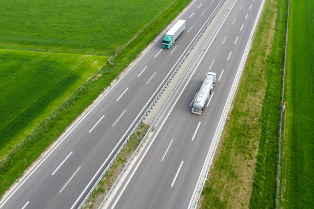 istock Trucks Speeding on Rural Highway 1276511812
