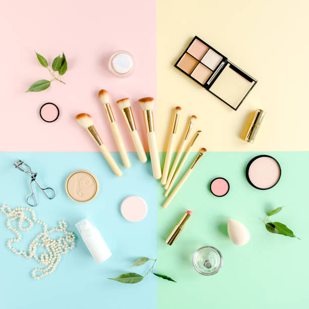 istock Professional decorative cosmetics and makeup tools brushes on colorful background. Beauty and fashion concept. Flat lay composition. Top view 1276511820