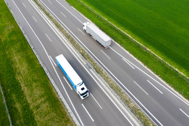 istock Trucks on Rural Highway, Aerial View 1276512420