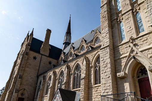 Ancient lanceolate window (ogive window) with stained glass, Gothic style temple in Limoges, France