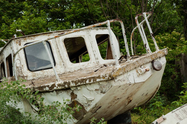 istock Old boat rotting at scrapyard 1276513495