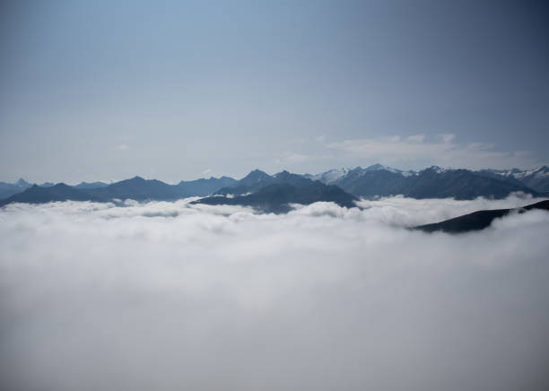 istock Mountain panorama of the Austrian Alps with low clouds 1276514917