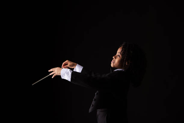 istock Girl in tuxedo with baton 1276517147