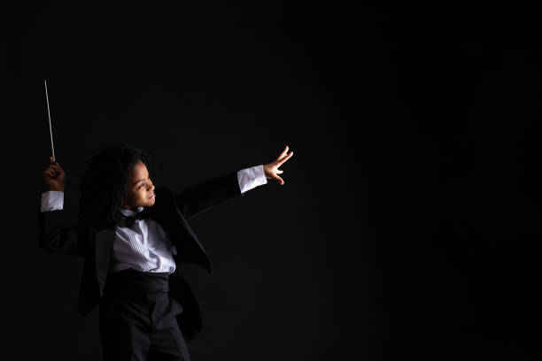 istock Girl in tuxedo with baton 1276517447