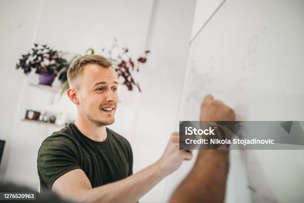 A Businessman Uses A Whiteboard Stock Photo - Download Image Now - Scrum - Sport, Men, Note - Message