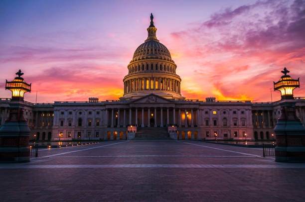Capital Building at Sunset The capital dome illuminated after dark in Washington DC. congress stock pictures, royalty-free photos & images