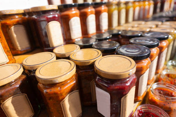 istock Shelf with glass jars of jam or marmalade 1276522829