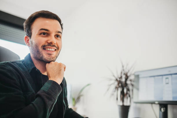 istock Young businessman in his office 1276523113