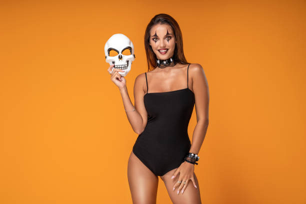 Halloween Sexy Girl wearing costume and joker's makeup.