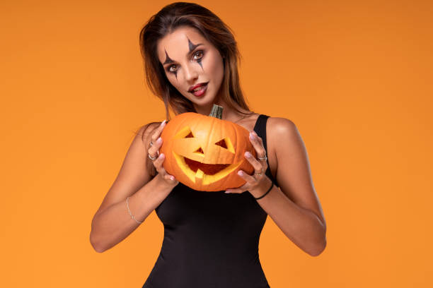 halloween sexy woman with pumpkin. - witch beauty beautiful women imagens e fotografias de stock