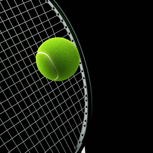 istock Tennis racket with ball on black background 1276531829