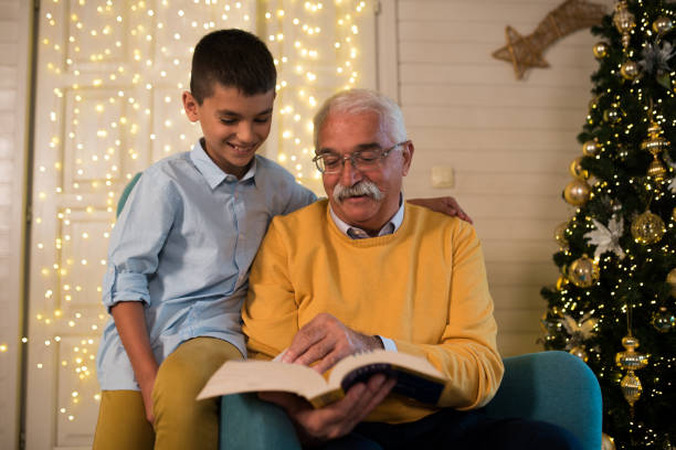 istock Reading Christmas stories with grandpa 1276532876