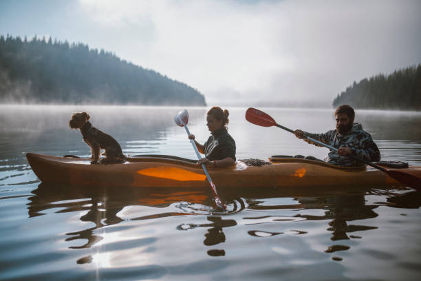 istock Adventurous Couple Are Kayaking With Their Dog 1276533582
