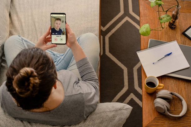Woman using dating app on mobile phone