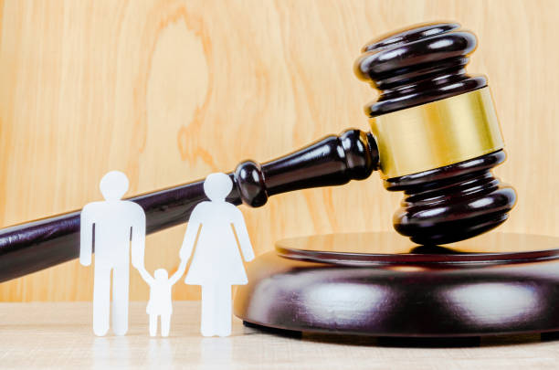 istock Family figure and gavel on table. 1276548698