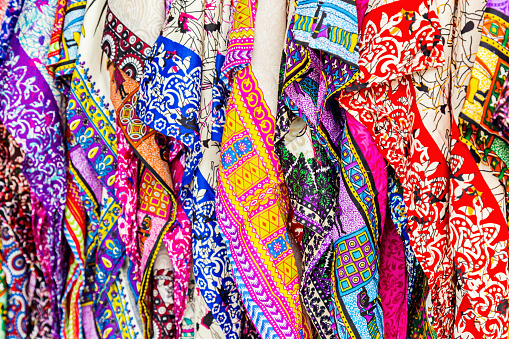 Beautiful patterned on the Thai style garment, batik and clothing for sale at the local market.