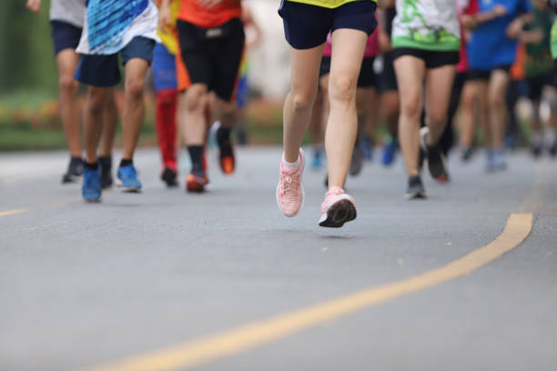 istock Group of people running race marathon 1276561692