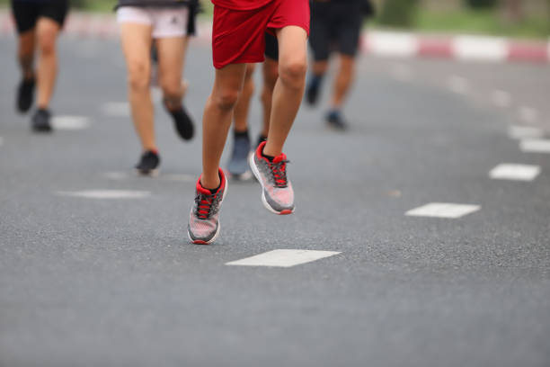 istock Group of people running race marathon 1276561694