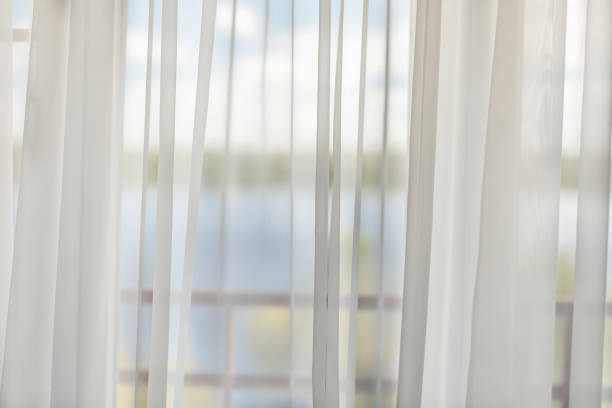 istock view from the window on a sunny landscape through white transparent curtains no focus 1276561753