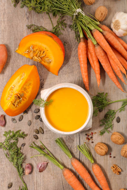 istock carrot and pumpkin soup- top view 1276561880