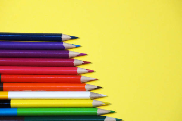 istock multicolored pencils on a yellow background close-up 1276563793