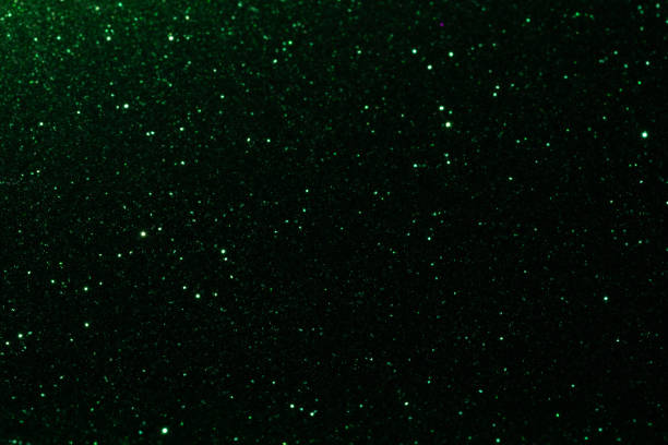 istock Blurry colored Christmas holiday lights on a black background 1276564095