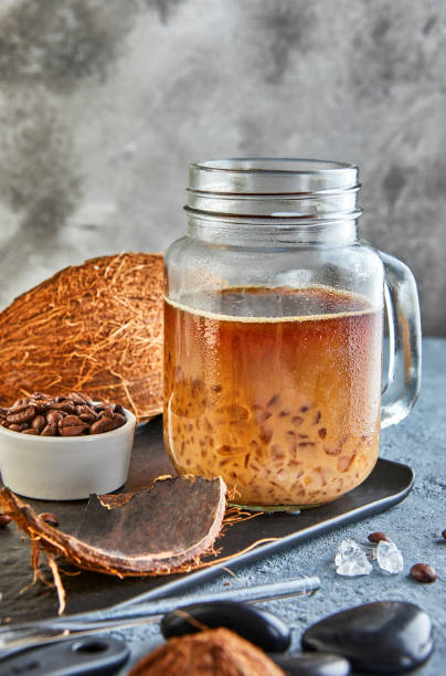 istock Thai Iced Coffee with Coconut Milk with Crushed Ice in a Mason Jar 1276564854