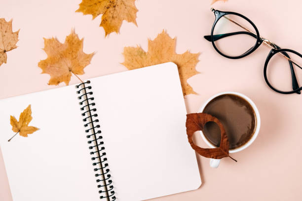 istock Autumn composition. Dried various leaves, coffee milk latte cup, eyeglass and notebook on pink studio background for advertisement. Autumn, fall, thanksgiving day concept. Flat lay, top view 1276566492