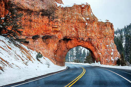 Rock arch over the highway in Utah in winter