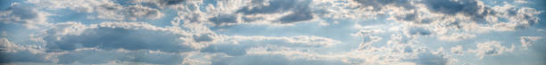 istock Panorama of blue sky with fluffy white clouds. Abstract background. 1276568409