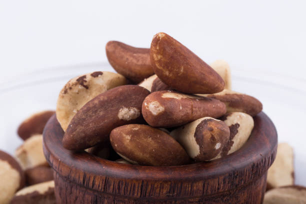 istock Brazil nuts close-up isolated on white background. 1276568703