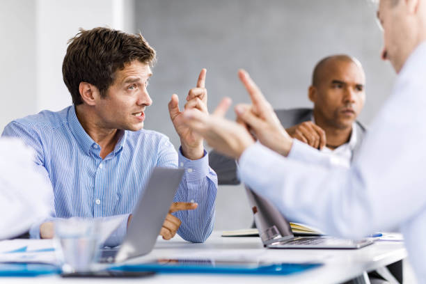 Communication problems on a business meeting! Frustrated entrepreneurs arguing during a business meeting in the office. arguing stock pictures, royalty-free photos & images
