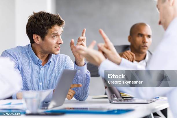 Communication Problems On A Business Meeting Stock Photo - Download Image Now - Arguing, Conflict, Working