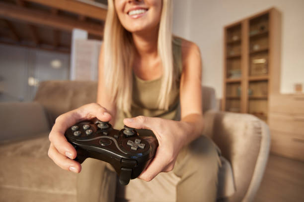 istock Woman playing with joystick 1276569658