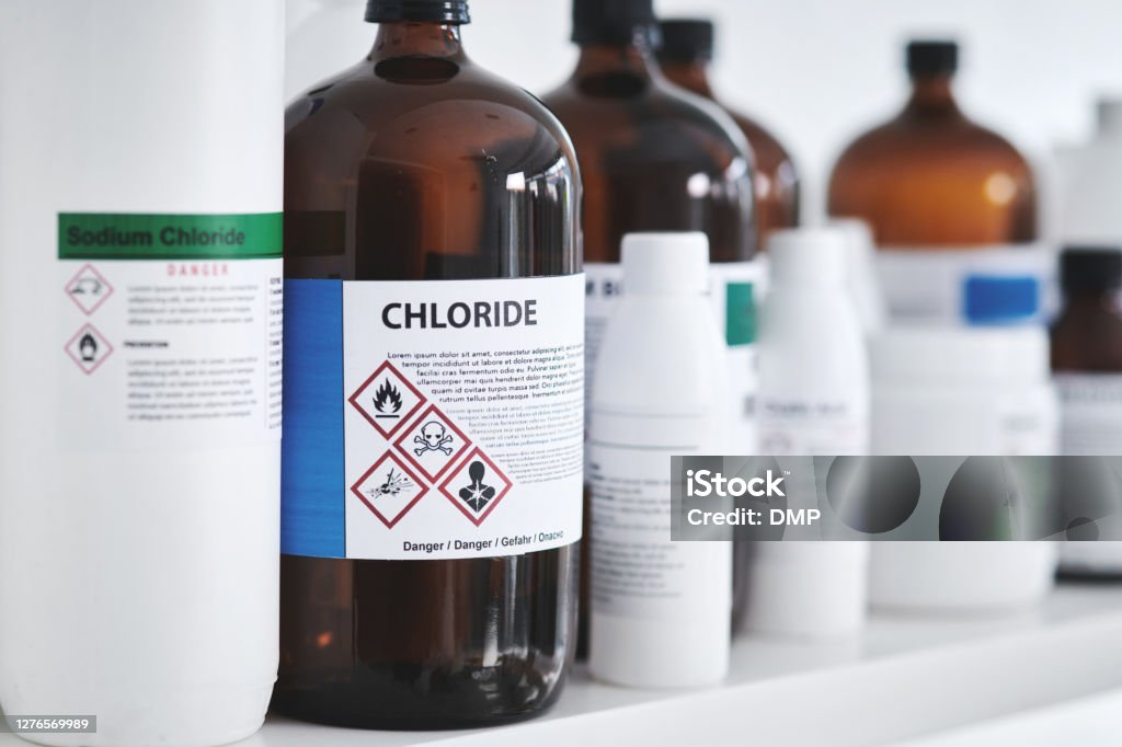 Common lab chemicals Shot of bottles of chemicals on a shelf in a lab Chemical Stock Photo